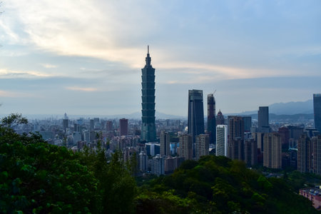 Aerial view of skyline of Taipei city with Taipei 101 Skyscraper at sunset from Xiangshan Elephant Mountain. Beautiful landscape and cityscape of Taipei downtown buildings