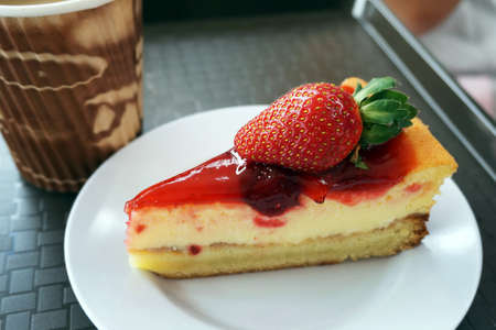 Afternoon tea with a delicious strawberry cheesecakeの写真素材