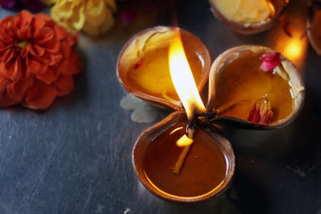 Typical Indian earthen clay oil lamp called ?Deepam? creating a wonderful and serene atmosphere