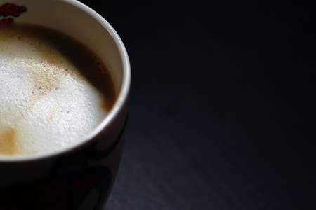 Top view of a cup of Coffee on a dark backgroundの写真素材