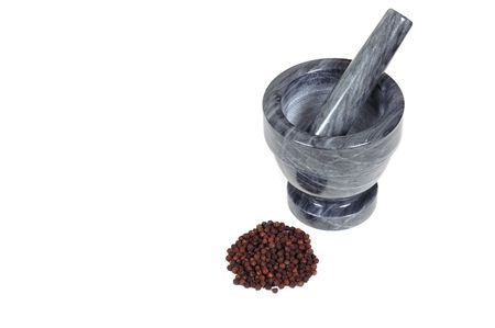 Gray mortar and pestle with peppercornsの写真素材