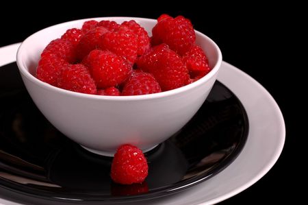 Luscious rasberries in white bowlの写真素材