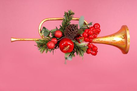 Gold horn Christmas Ornament with holly on Ruby backgroundの写真素材