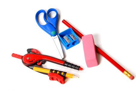 New school supplies including compass, scissors, pencil, sharpener and eraser