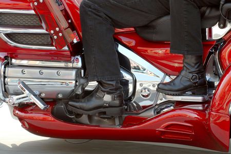 The side view of two motorcyclists on a motorcycle during a paradeの写真素材