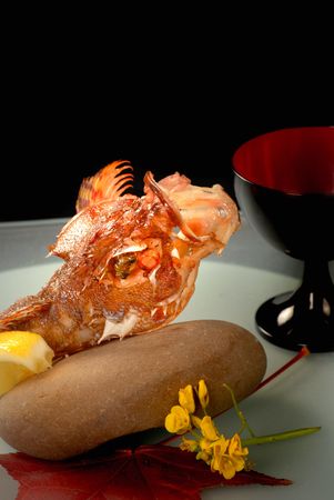 Asian Lion Fish that has been deep fried and served with lemon