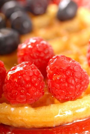 Freshly made waffle with raspberries and blueberriesの写真素材