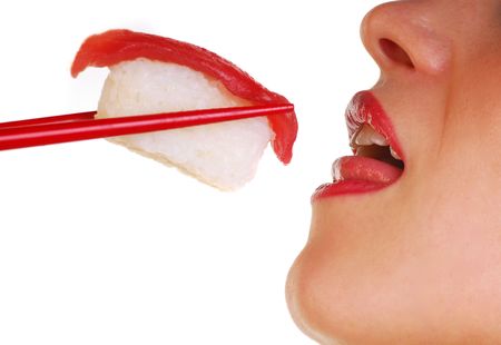Sensual image of sushi being fed to a sexy womanの写真素材