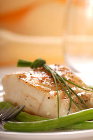 Fresh sauteed cod fillet with green beans and chives