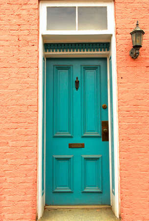 Old colorful colonial door with lantern found in Frederick, Marylandの写真素材