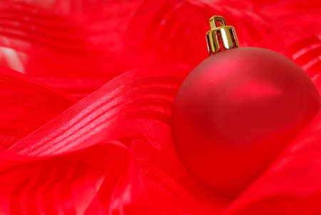 Beautiful red Christmas ornament on red ribbonの写真素材