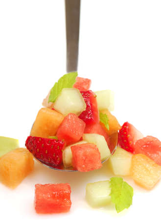 Fresh fruit salsa containing watermelon, orange, cantaloupe, strawberries, musk melon and mintの写真素材