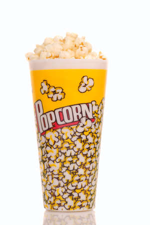 Container of delicious movie popcorn on whiteの写真素材