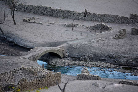 remains of a city that was submerged in the waters of a swampの写真素材