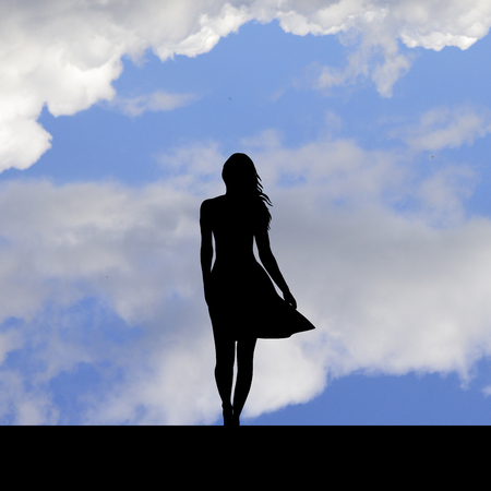 Suicidal attempt,silhouette of woman standing on the edge of a roofの写真素材