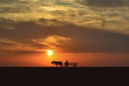 Wagon silhouette at sunsetの写真素材