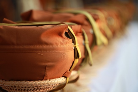 row of monk alms bowlsの写真素材