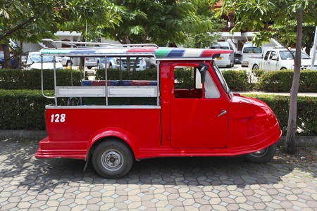 red tuktuk in thailand