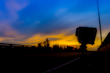 Sun rise in thailand and small cameraの写真素材