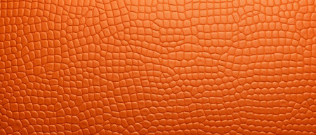 Orange leather texture background. Close up of orange leather texture background.の素材