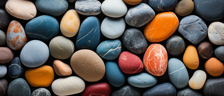 Colorful pebbles background, top view, flat lay.の素材
