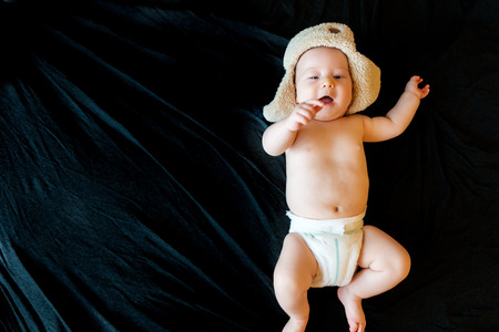 innocent baby on a black background