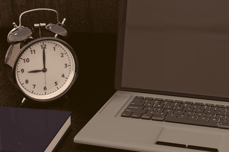 3D rendering of a clock, laptop and book for studies for works with time efficiencyの写真素材