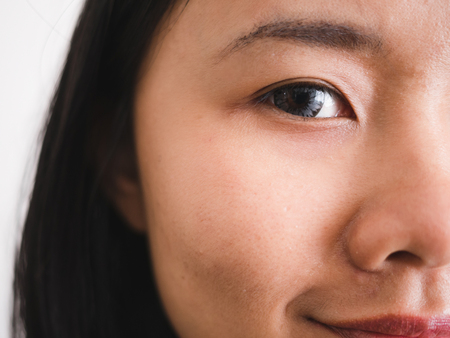 Close up of a woman's eyes wearing contact lensの写真素材