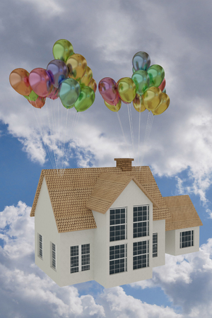 3D rendering of a house flying with balloon to the skyの写真素材