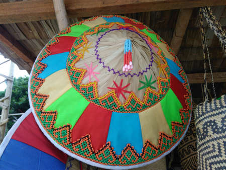 traditional leaf-based community hats used by farmersの写真素材