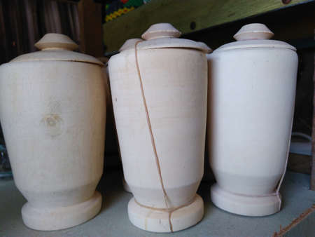 bottles made of carved wood for treatment herbalの写真素材