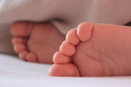 Closeup of small baby feetの写真素材