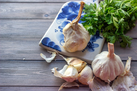 Garlic and parsley on cutting board