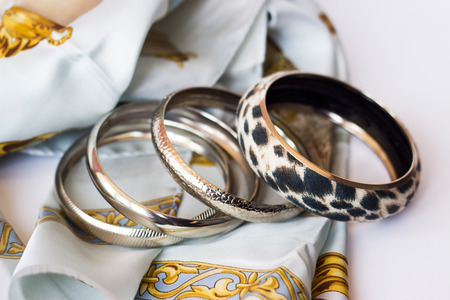 Leopard bracelet on silk scarf; fashion accessoriesの写真素材