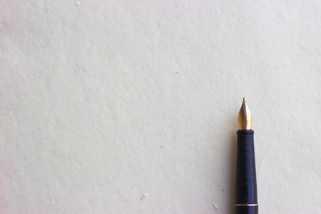 Old fountain pen on aged paperの写真素材