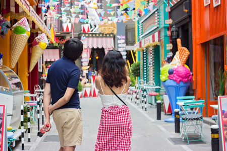 ATHENS, GREECE - JULY 16, 2017: Man and woman taking pictures of colorful decorated streets at Psiri area,  Athens city, near Monastirakiのeditorial素材