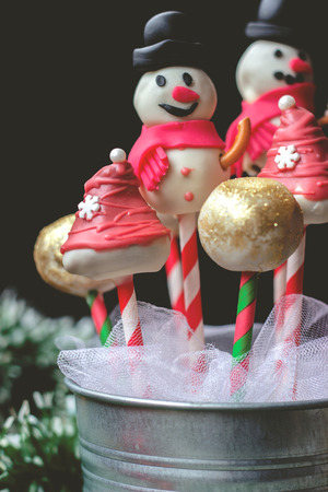 Cake pops decorated for christmas, on dark backgroundの写真素材