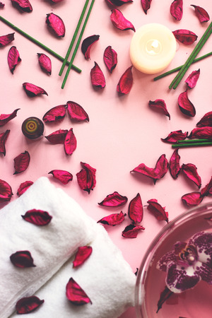 Towels, potpourri and scented sticks on pink background with copy space for your text; wellness or spa backgroundの写真素材