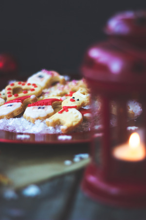 Royal icing decorated christmas cookies on wooden backgroundの写真素材