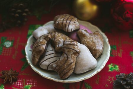 Gingerbread cookies on table, with Christmas decoration; festive foodの写真素材