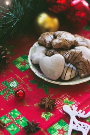 Gingerbread cookies on the table, with festive Christmas decorationの写真素材