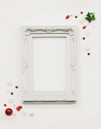 Composition made of white photo frame with Christmas decoration; Christmas photo frame mock upの写真素材