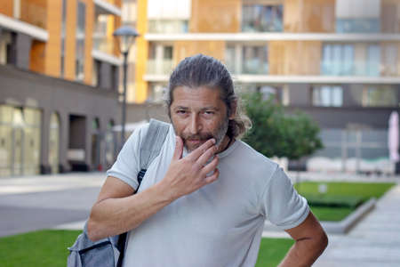 Portrait of a middle aged man looking at camera, being serious