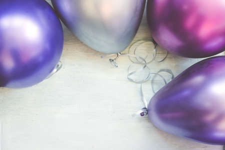 Colorful balloons on white background; party background with copy spaceの写真素材