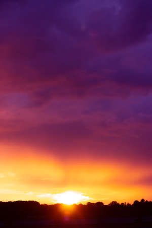 Beautiful pink and orange sunset over the city; nature backgroundの写真素材