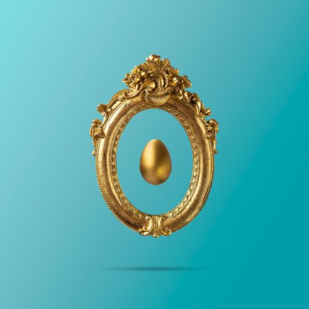 Golden egg in old golden vintage frame. Minimal elegant Easter compositionの写真素材