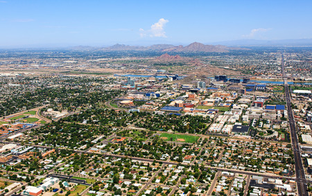 Aerial view of Tempe, Arizona looking to the northwest including Papago Park, Camelback Mountain and Piestewa Peakの写真素材