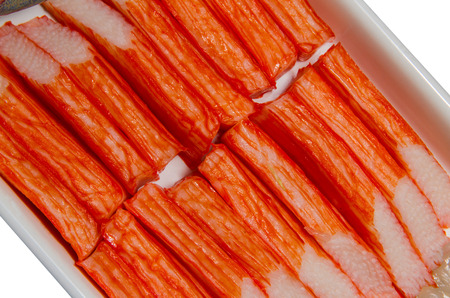 Imitation crab meat on a white plate.の写真素材