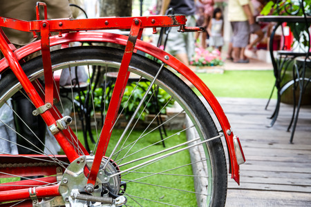 Red bicycle equipped with a large basketの写真素材