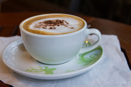 Cup of coffee on a wooden table.の写真素材